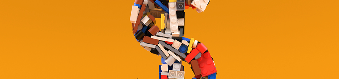 image of Lego pieces against orange background