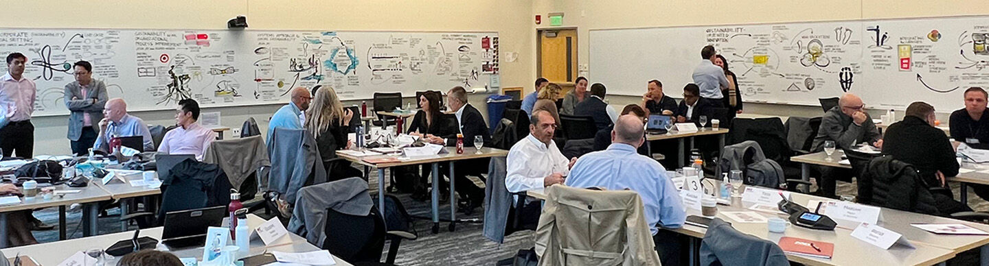 image of MIT faculty teaching in classroom surrounded by scribing