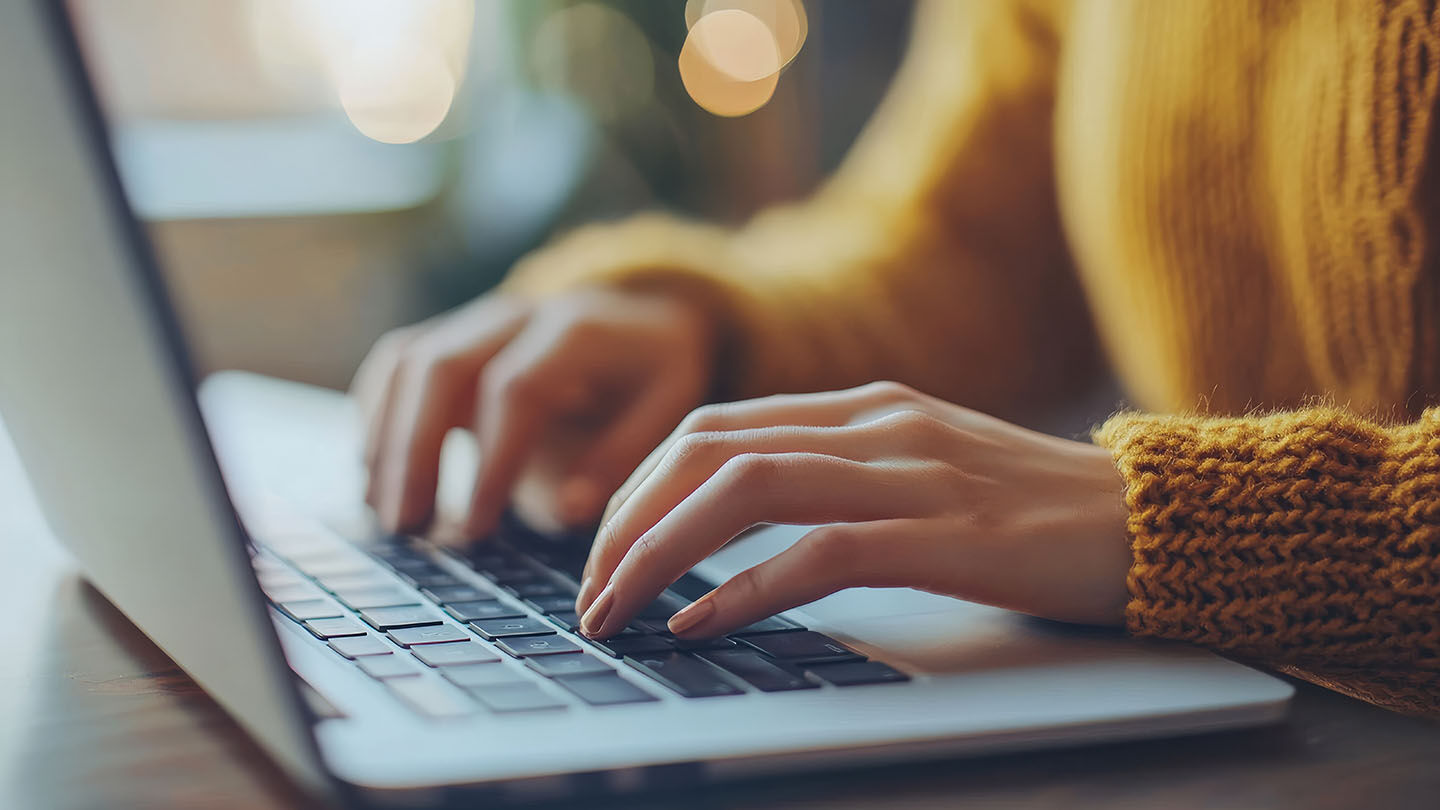 woman typing on a computer