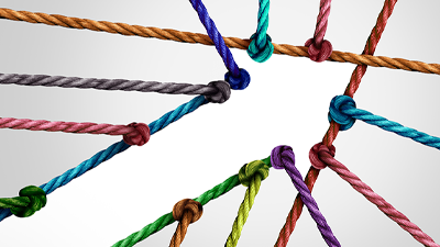 multi-colored ropes coming together to form an arrow