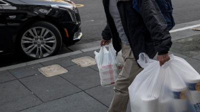 photo of a person carrying groceries