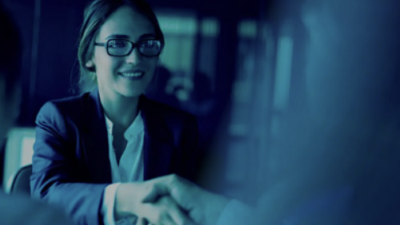 image of woman working behind computer