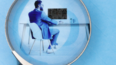 person sitting at desk under a loop