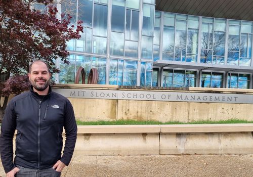 Bruno Machado standing in front of MIT Sloan building E62 Bruno Machado standing in front of MIT Sloan building E62