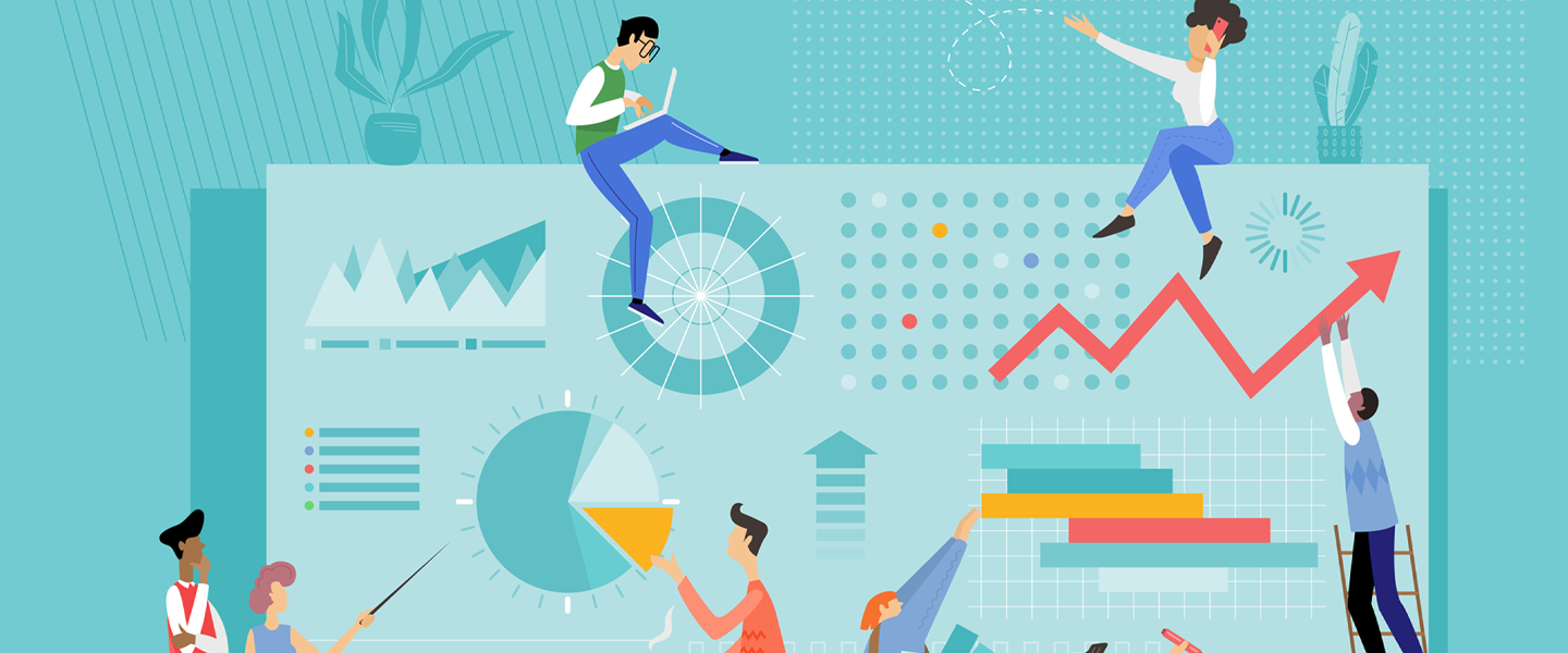 laptop with people working on and around it