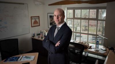 Bruce Cameron posing in a office