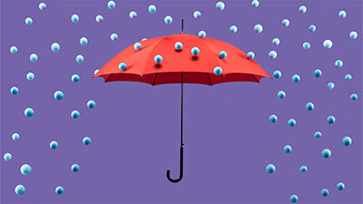 a red umbrella against a purple background deflecting spheres