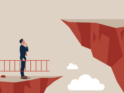 man with ladder looking at cliff