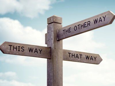 sign post pointing to various ways