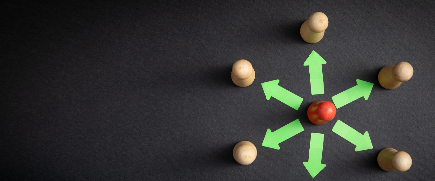 Delegation concept. Wooden human figures with a arrows