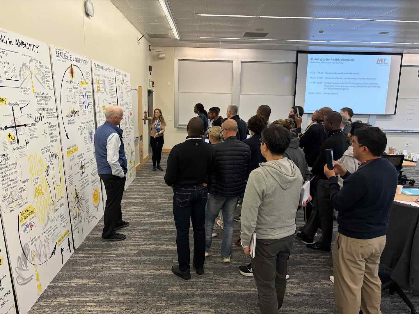 Faculty &ldquo;walk the boards&rdquo; with participants to review week one of the Advanced Management Program (AMP) 2026, to encourage pattern-recognition and reflection.