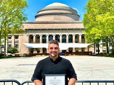 Freddy Leon stands in front of MIT Great Dome with his ACE certificate Freddy Leon stands in front of MIT Great Dome with his ACE certificate
