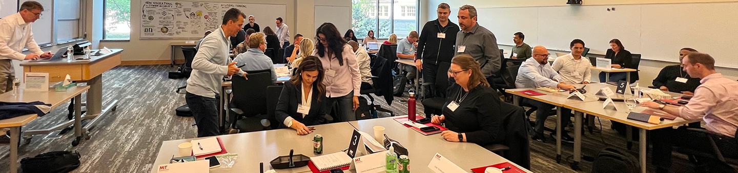 image of MIT faculty teaching in classroom surrounded by scribing