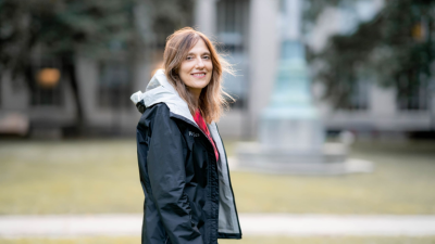 Regina Barzilay in a black jacket on MIT campus