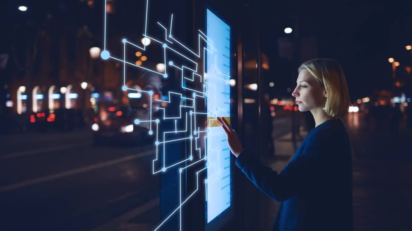 woman touching a digital screen