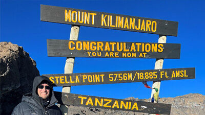 Peter Aberg at the top of a mountain summit