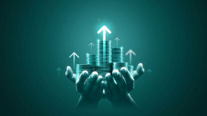 hands holding stacks of coins with arrows pointing up image number null