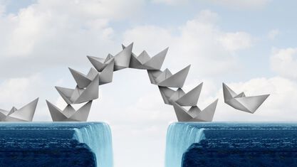 paper boats linking two frozen sheets together image number null