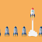 Cartoon image of rocket ship taking off while five others sit on the ground next to it.