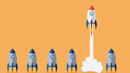 Cartoon image of rocket ship taking off while five others sit on the ground next to it. image number null