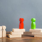 Wooden blocks shaped like people.