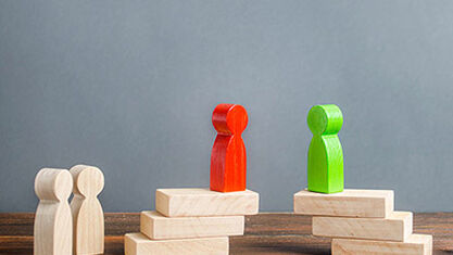 Wooden blocks shaped like people. image number null