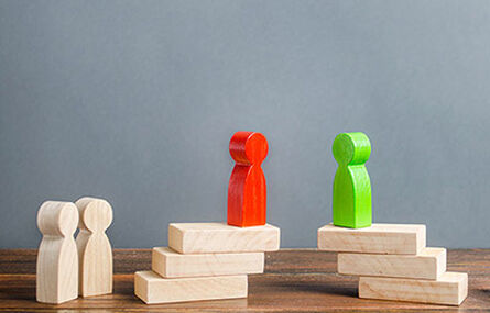 Wooden blocks shaped like people.