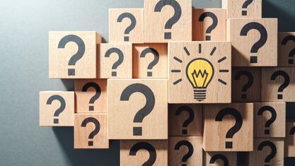 wooden cubes with question marks and lightbulbs image number null