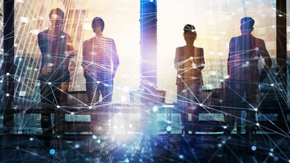 photo of a group of people looking ahead with a network overlay image number null