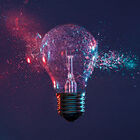 Lightbulb cracking with glass floating off of sides.