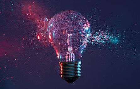 Lightbulb cracking with glass floating off of sides.