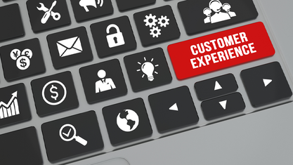 computer keyboard with red customer experience button image number null