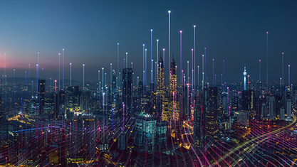 Photograph of a city lit up at night. image number null