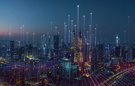 Photograph of a city lit up at night.