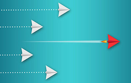 Paper airplanes flying on blue background.
