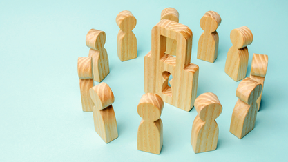 illustration of wood peg people around a wooden lock image number null