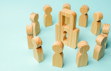 illustration of wood peg people around a wooden lock