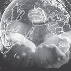 black and white image of hands holding a globe