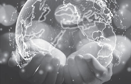 black and white image of hands holding a globe