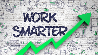 Brick wall that reads ‘Work Smarter’ and that includes illustrations of elements on how to maximize productivity and an arrow trending upward image number null