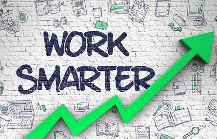 Brick wall that reads &lsquo;Work Smarter&rsquo; and that includes illustrations of elements on how to maximize productivity and an arrow trending upward