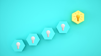 Light bulbs in a line with last one lit up. image number null