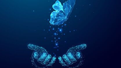 digital hands letting of a digital butterfly flying off image number null