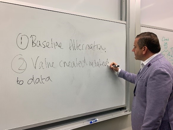 Bill Acheson writing on a whiteboard