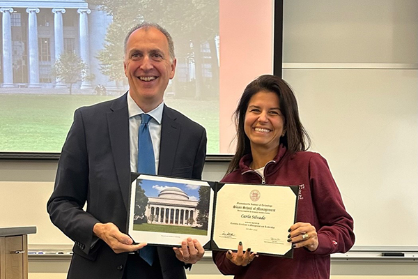 Carla Silvado receiving her Executive Certificate from Senior Associate Dean Peter Hirst