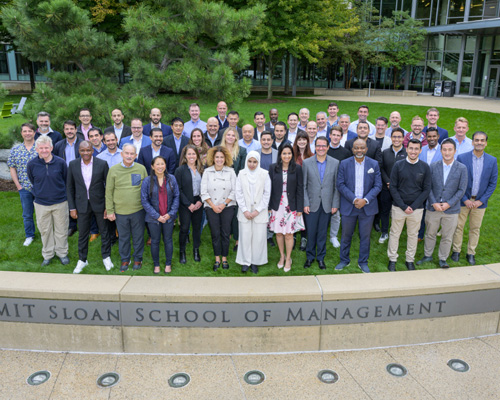 group shot of 2022 DSI cohort in front of MIT E62