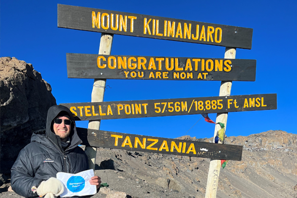 Peter Aberg at the summit of Mt. Kiliminjaro